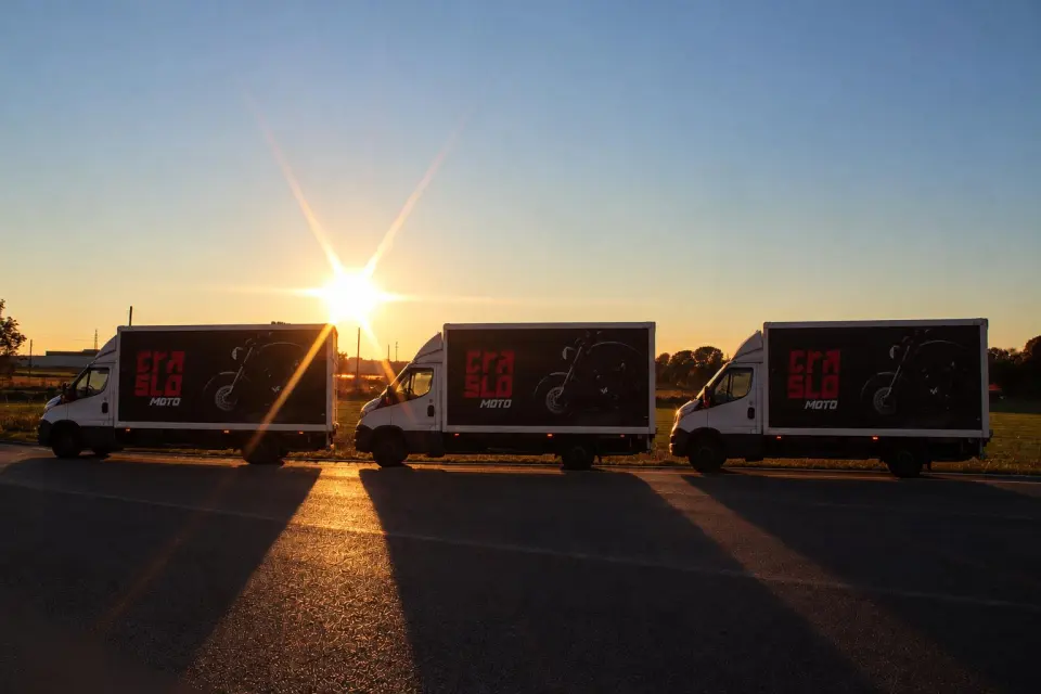 TrasloMoto van on the road at sunset